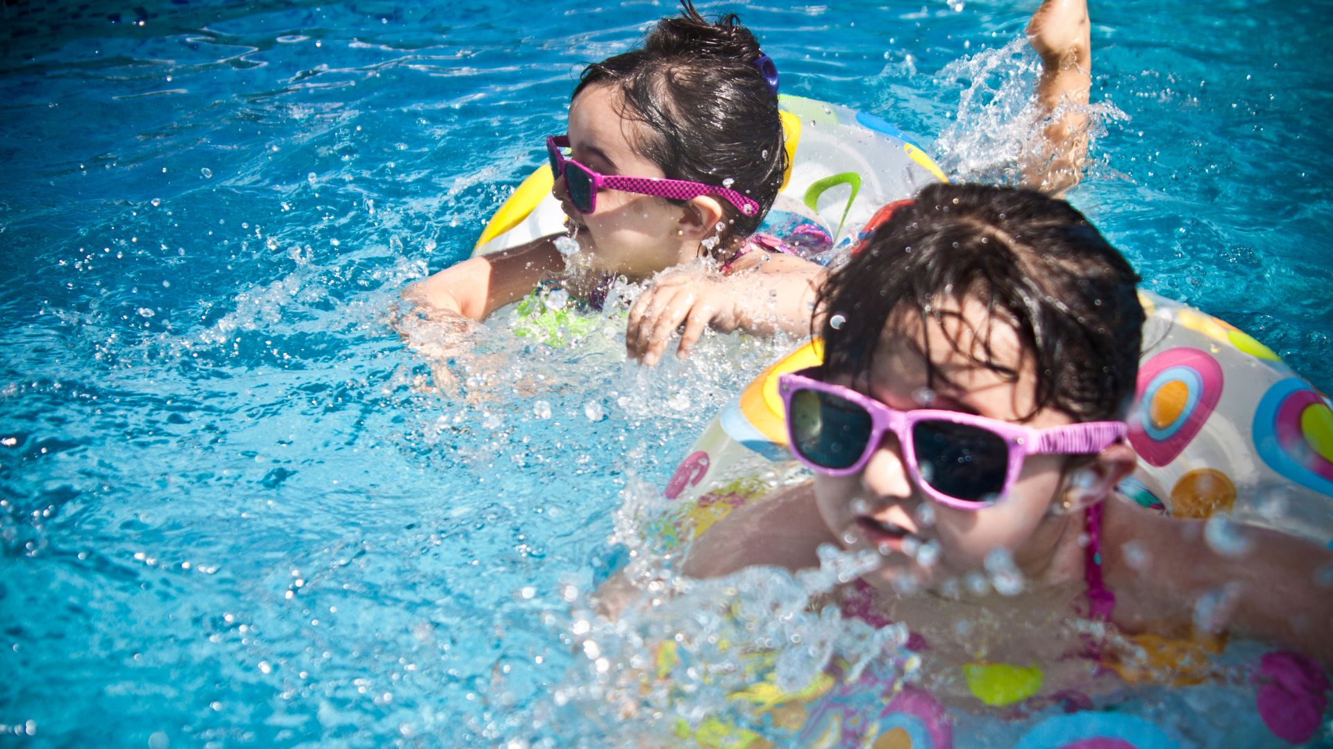 Children enjoying a swimming pool